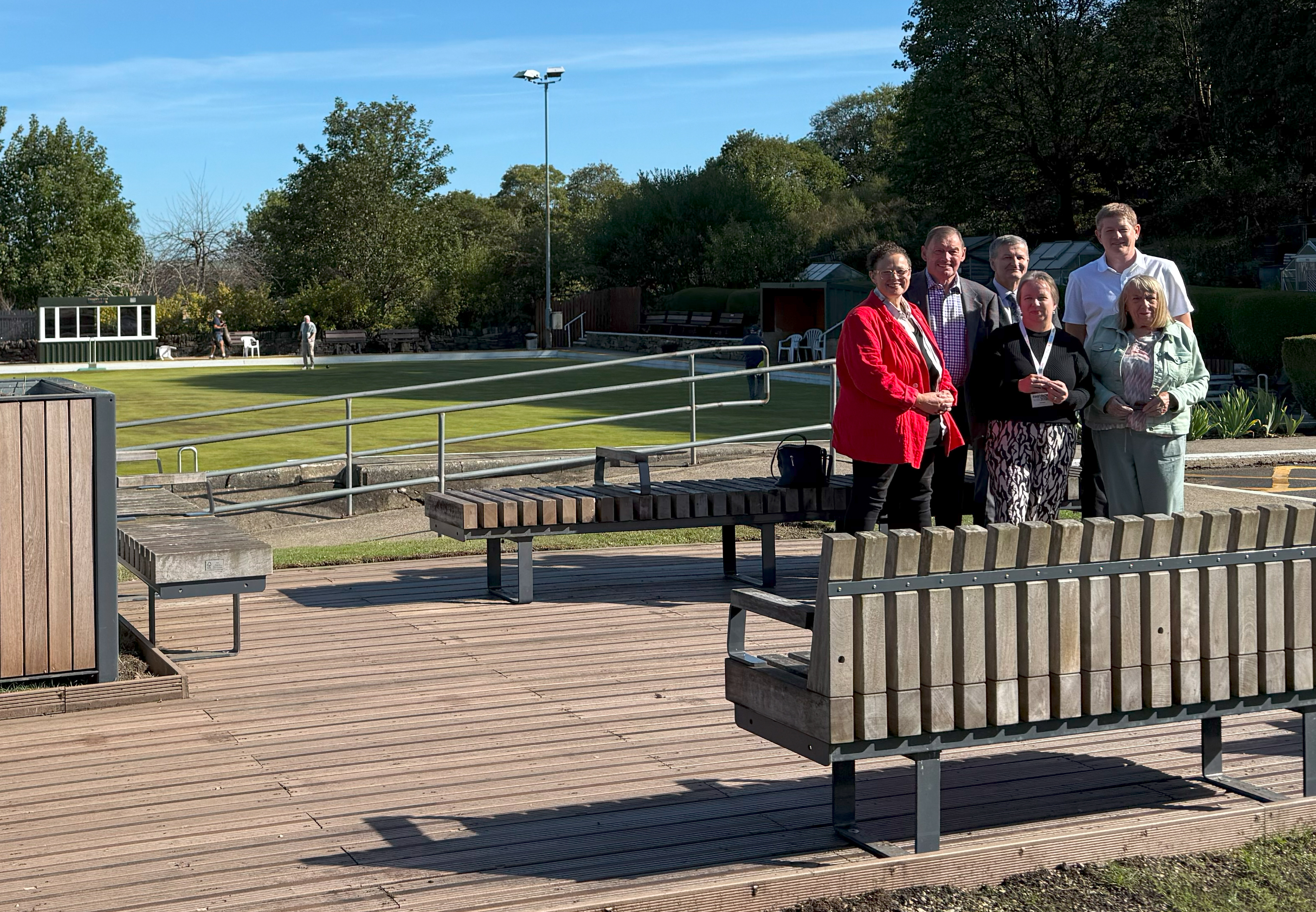 Parklet at Brighouse Bowling Club. From left to right: Councillor Sarah Courtney, Calderdale Council’s Cabinet Member for Regeneration and Transport; Eddie Baikie, President of Rastrick Bowling and Social Club; David Whitehead, Co-Chair of Brighouse Town Deal Board; Amanda Caldwell, Chair of Rastrick Big Local; Paul McRae, Assistant Project Manager at Calderdale Council; Janet Holroyd, Secretary of Rastrick Bowling and Social Club.