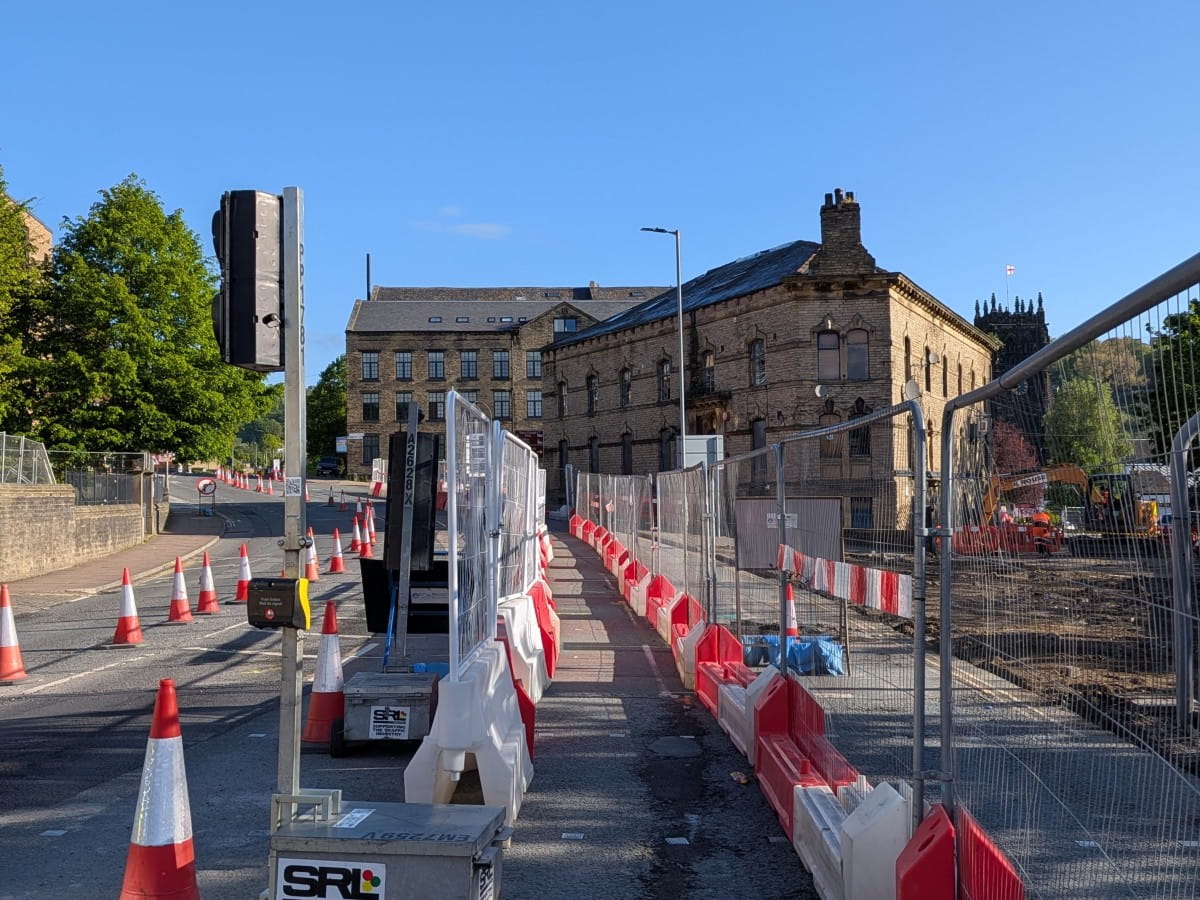 Temporary crossing on Square Road and walking routes open on both sides.