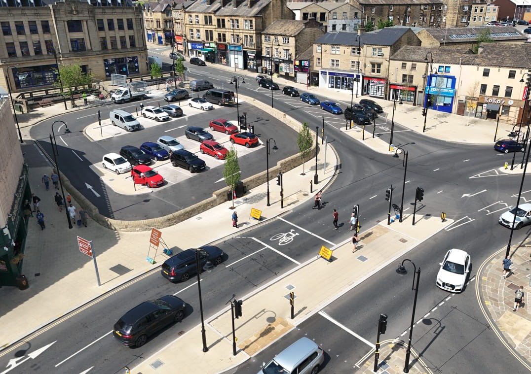 The new junction and crossings at Bull Green. Cars in the new car park. 